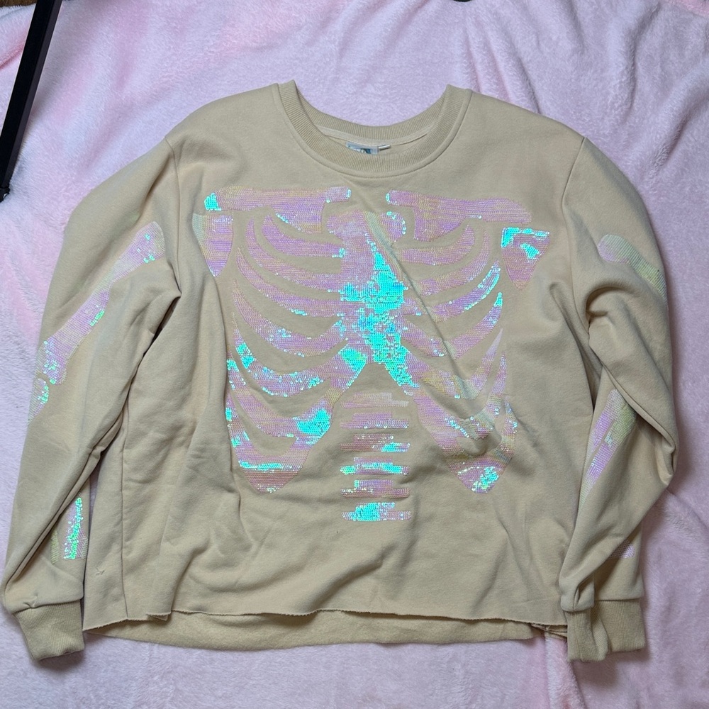 Queen Of Sparkles Cream Sweatshirt with Iridescent Skeleton Design